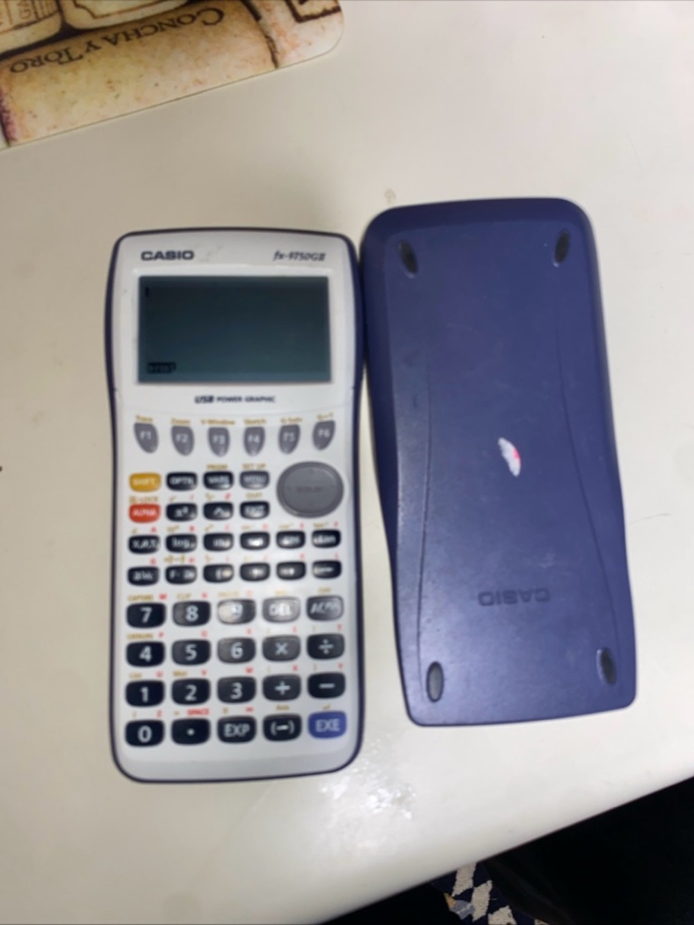 Casio Graphing Calculator in White and Purple Cover
